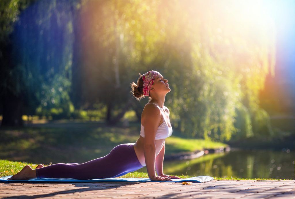 woman doing yoga in the sunlight