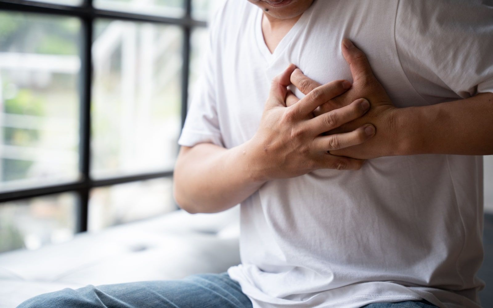 Man Holding Chest Pain