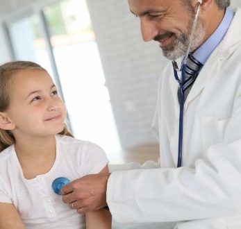 Doctor checking kid
